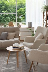 Stylish sofa and other furniture in living room. Interior design