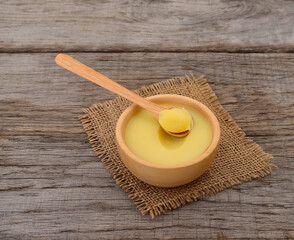 Ghee in a wooden bowl.