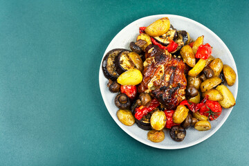 Roast pork with different vegetables.