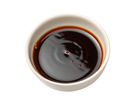 Soy sauce in white bowl on white background for Asian cooking and seasoning delicious meals