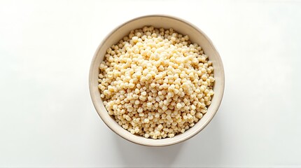 Pearl Couscous in Round Bowl on White Tabletop Background