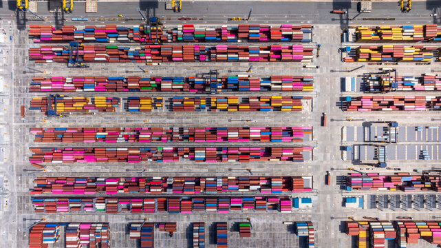 Aerial view global business logistic transportation container cargo international terminal port, Container cargo industrial import export port by container cargo ship, Sea freight shipping container. - Powered by Adobe
