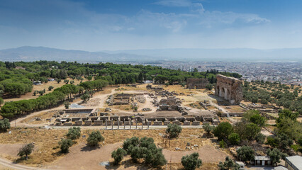 Ancient Ruins of Tralleis in Aydin, Turkey with Mountains and Olive Trees