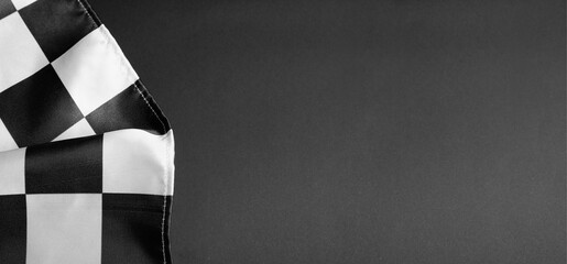 Racing flag on black background with space for text