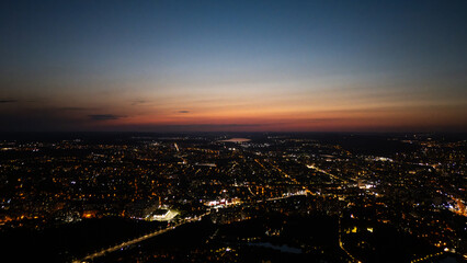 Fototapeta premium Aerial Sunset City Lights Urban Panorama