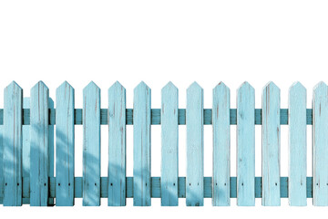 Light blue painted wooden fence with peaked tops, casting shadows