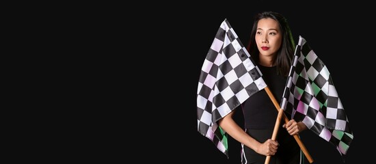 Beautiful Asian woman with racing flags on dark background with space for text