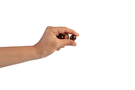 Chocolate ball in hand on transparent background