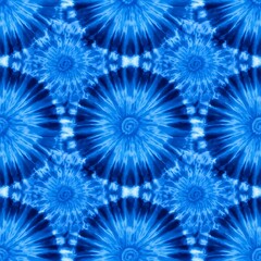 A vibrant tie-dye pattern in shades of blue and indigo.