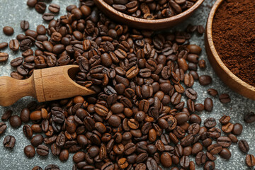 Heap of coffee beans on grey background