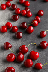 Many sweet cherries on grey background
