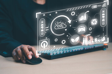 A person interacts with a futuristic interface displaying environmental data and sustainability icons, emphasizing technology's role in combating climate change.