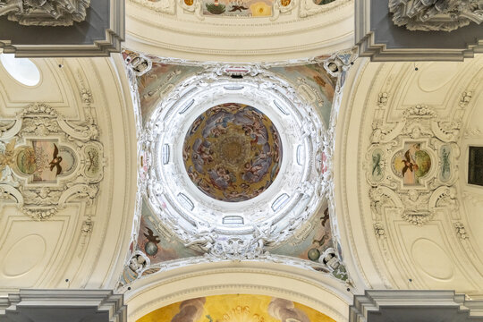 View of ornate, light-filled dome featuring intricate frescoes and decorative plasterwork, a masterpiece of Baroque architecture, Graz, Steiermark, Austria.