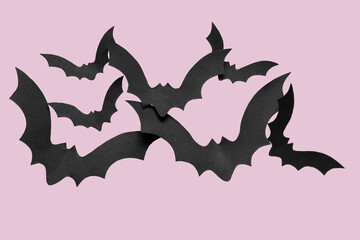 Paper bats for Halloween party on lilac background