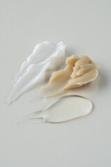 Cosmetics swatches, textures, cream, gel, bright background