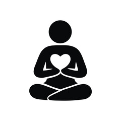 Silhouette of Person in Lotus Position Holding Heart Symbolizing Love, Peace, and Harmony Through Meditation and Mindfulness