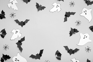 Composition with paper bats and ghosts on white background. Halloween celebration concept