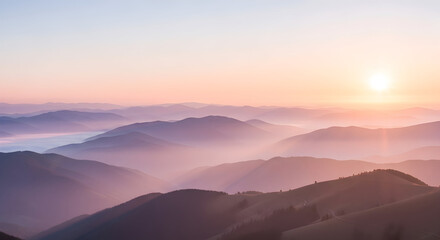 Obraz premium Breathtaking Panorama of Rolling Misty Mountains at Sunset or Sunrise, with Soft Pastel Hues of Pink, Orange, and Purple Painting the Sky, Evoking Serenity and Natural Beauty