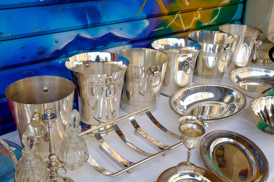 Paris, France, Europe.  The famous and worlds largest flea market - the St. Ouen "Marche des Puces. Silver champagen buckets for sale