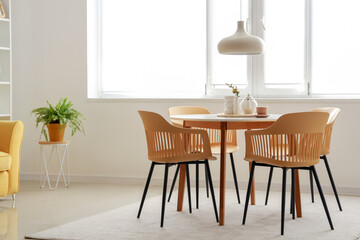 Dinning table with chairs in room