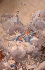 FLORENCE, ITALY - MARCH 17, 2025: The baroque fresco of  Holy Trinity, Virgin Mary and St. Peter of Alcantara in church chiesa di San Salvatore in Ognissanti by Matteo Bonechi (1722).