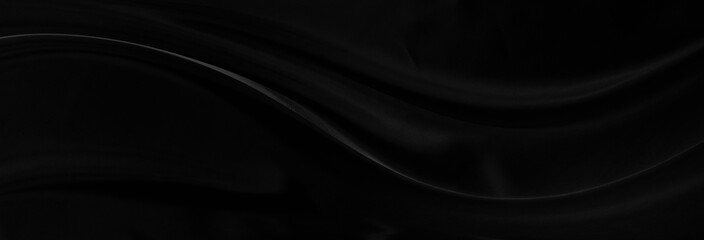 Black gray satin dark fabric texture luxurious shiny that is abstract silk cloth background with patterns soft waves blur beautiful.