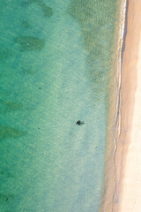 A beautiful texture of water and sand, a perfect abstract nature photo. Top down drone view