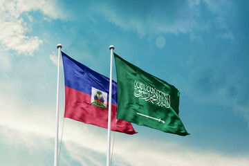 Haiti Saudi Arabia friendship flags are waving in the sky. Two country flag for agreement or deal. HaitiKSA national flag for commitment.
