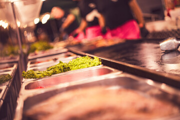 Chefs preparing ingredients in food truck kitchen