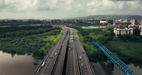 Aerial view of Navi Mumbai near Navi Mumbai International Airport, showing modern roads, scenic surroundings, and urban infrastructure. Ideal for smart city and development themes. 