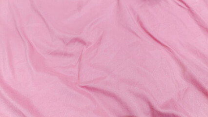 Fototapeta premium Close-up view of a smooth, draped, light pink fabric.