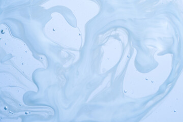 Fluid abstract pattern of light blue swirls with air bubbles. Clean and versatile background for...