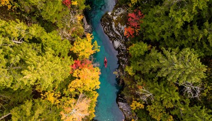 Lone Red Kayak on a Turquoise River, an Aerial View of Autumn's Splendor