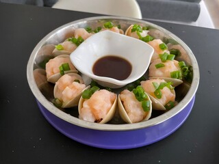 Steamed prawn paste in clams. Home cooked