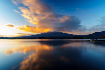 Sunrise Symphony: Reflection of Mount Fuji with Glowing Cloud on Lake Surface