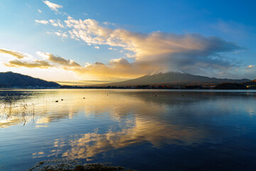 Sunrise Symphony: Reflection of Mount Fuji with Glowing Cloud on Lake Surface