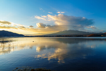 Sunrise Symphony: Reflection of Mount Fuji with Glowing Cloud on Lake Surface