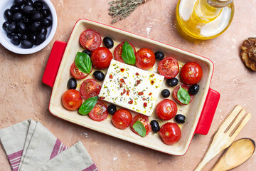 Baked feta cheese with tomatoes and olives. Healthy food. Vegetarian food.