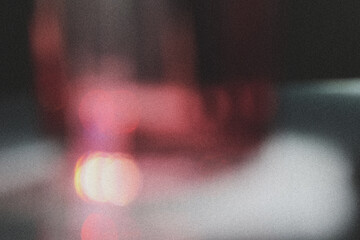 Abstract red light, modern blurred background film grain texture with dust. Elegant light design...