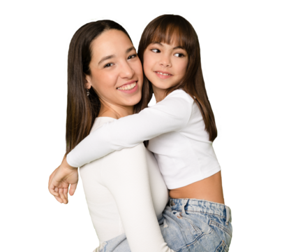 Funny smiling young woman and little kid girl sisters wearing casual t-shirts hugging looking camera isolated on transparent background.