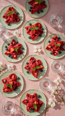 Fruity Red Crepes on Pink Tiles in a Bright Spring Dessert Flat Lay