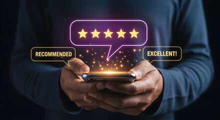 Close Up of Hands Holding Smartphone Displaying Glowing Five Star Rating for Customer Satisfaction and Feedback on Dark Background
