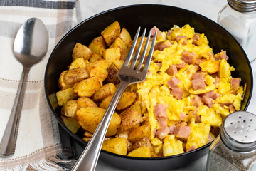 scramble eggs  with diced spam  and home fries