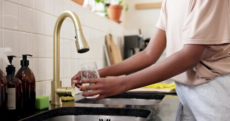 Home, hands and woman with tap water in glass for hydration, natural nutrients and thirsty. Kitchen, person and pour liquid at faucet for refreshing drink, fresh beverage and body detox for wellness - Powered by Adobe