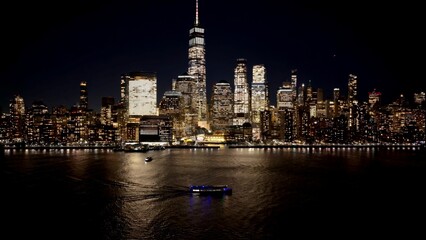 Obraz premium New York Skyline In Manhattan New York United States. Aerial View Of A Bustling City With High-Rise Buildings And Traffic. Night Freeway Road Downtown Cityscape. Night Up Above.
