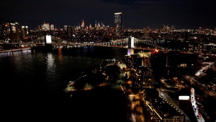 Brooklyn Bridge In Manhattan New York United States. Aerial View Of A Bustling Downtown Cityscape...
