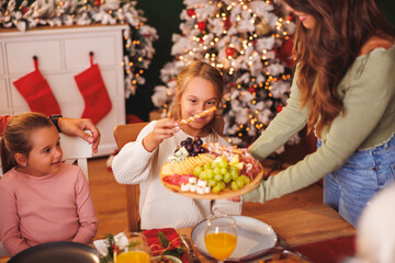 Family having Christmas dinner at home
