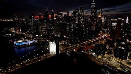 Obraz premium Brooklyn Bridge In Manhattan New York United States. Traffic Is Moving Across A Modern Cable-Stayed Bridge. Building Construction Skyline Skyscrapers Amazing. Construction Skyscrapers Night.
