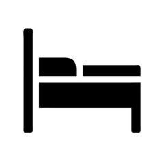 A close up of a black cat with bright green eyes looking directly at the camera