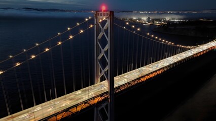 Obraz premium Sunset Oakland Bay Bridge In San Francisco California United States. Elevated Road Bridge Symbol Of The City Viewed From Above. Building Town Sky Clouds Illumination Urban.